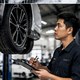 Technician inspecting a vehicle