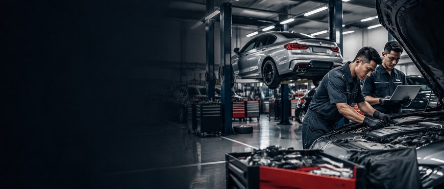 Mechanics diagnosing a vehicle in the workshop