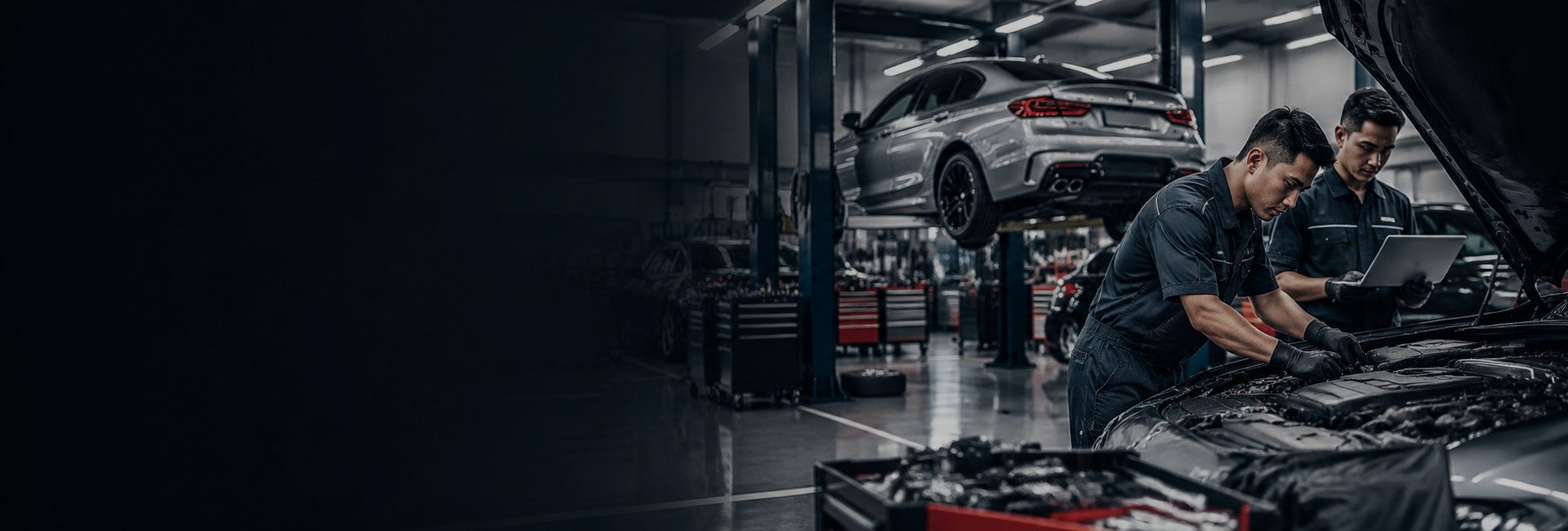 Technicians inspecting a vehicle in a modern garage