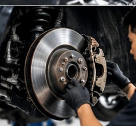 Technician checking a brake assembly